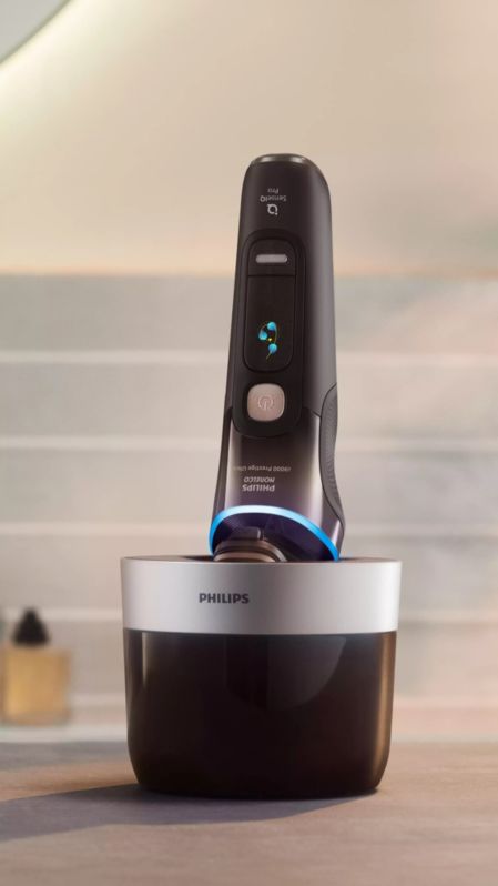 A hand holding an electric shaver